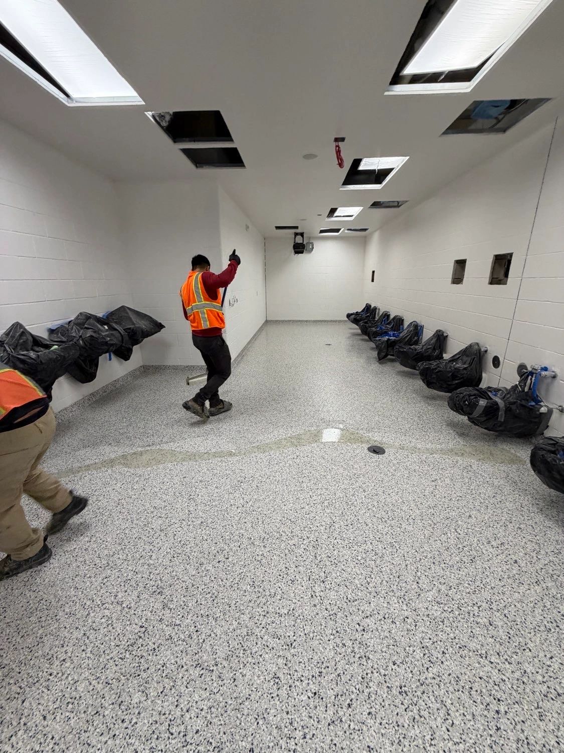 Locker Room Install — Decorative flake broadcast